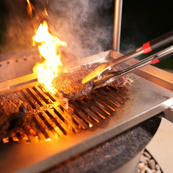 Flipping Steak On Grill Grate.jpg